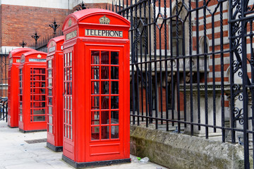 Row of iconic London red phone cabins.