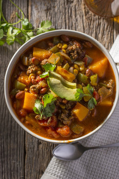 Bowl of Chili Soup with Glass of Brandy