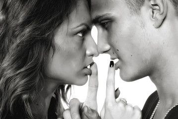 Teenagers looking into each others eyes, face to face.