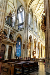 Fototapeta na wymiar Interior of the St. Vitus Cathedral. The cathedral is the seat of the Archbishop of Prague and is the biggest and most important church in the country.