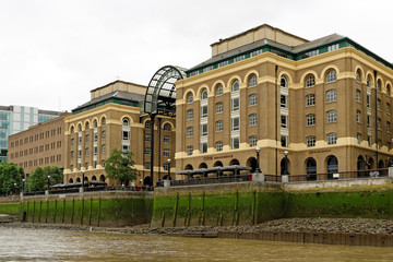 View from Thames river of the public open air Hay's Galleria. Originally a warehouse, it was converted to a major visitor attraction in the 1980s.