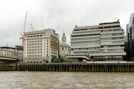 Adelaide House, a Grade II listed office building, St Magnus the Martyr Church and St Magnus House an office building, on the north bank of Thames river.