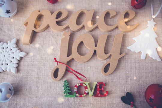 Peace joy love on holiday fairy light toning background