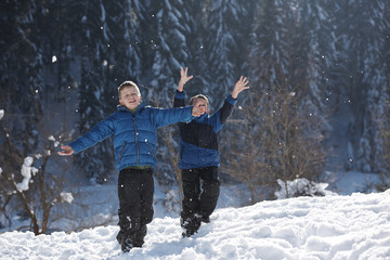 Fototapeta na wymiar kids playing with fresh snow