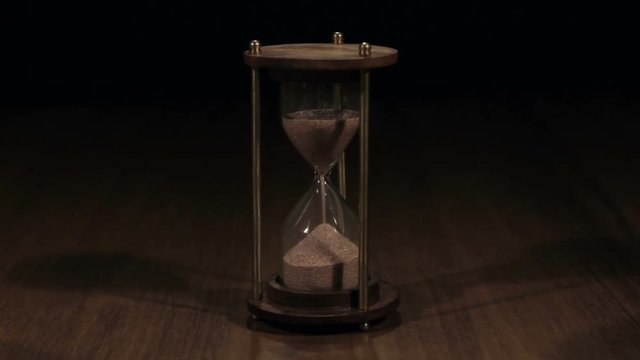 Hourglass on dark background.