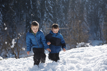 Fototapeta na wymiar kids playing with fresh snow