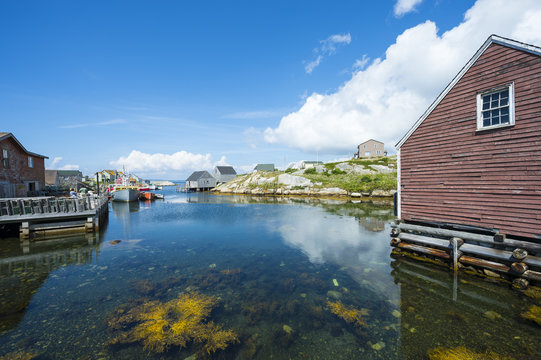 Scenic landscape view of the calm waters of the harbour in the fishing village of Peggy's Cove, in Halifax, Nova Scotia, Canada