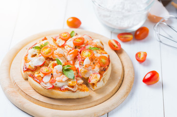 seafood Pizza on wood plate