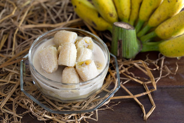 Banana in coconut milk thai dessert on pile of straw / Select fo