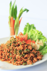 Spicy minced chicken salad isolated on white background
