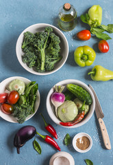 Fresh vegetables - broccoli, peppers, tomatoes, eggplant, squash, turnips on a blue background, top view. Cooking ingredients.