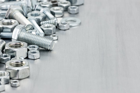 screws and bolts of different size for house renovation on scrat