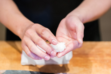 Close up hand of Japanese chef making sushi
