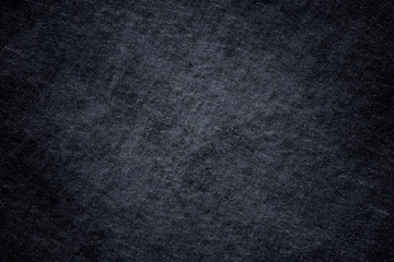Dark grey black slate background or natural stone texture.