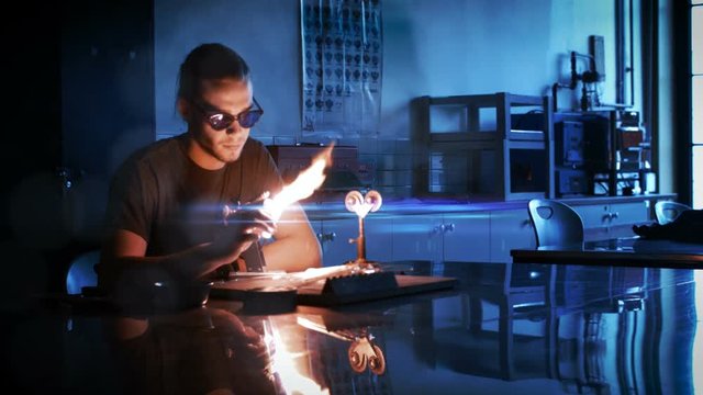 Cinemagraph of a Man Heating a glass rod