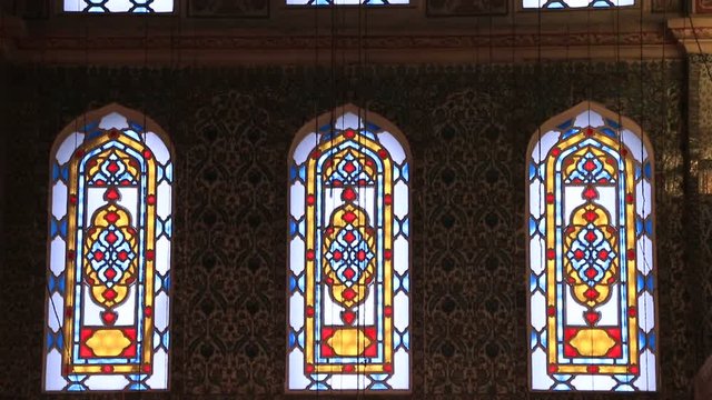 rows of stained-glass windows in the old building