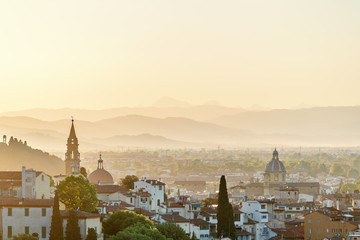 View of Florence in Tuscany at sunset with a rolling landscape