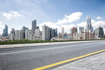 Fototapeta na wymiar cityscape and skyline of shanghai from empty road