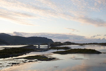 Twin bridge leading to Fredvang village, Lofoten islands, at sun