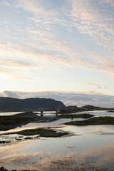 Twin bridge leading to Fredvang village, Lofoten islands, at sun