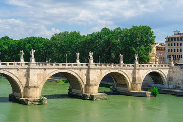 Fototapeta na wymiar Roma, Italy - August, 7, 2016: Bridge Ponte, Sant'Angelo from Tiber in Roma, Italy