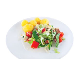 boiled potatoes with tofu, vegetables and almonds in vegan soy cream sauce