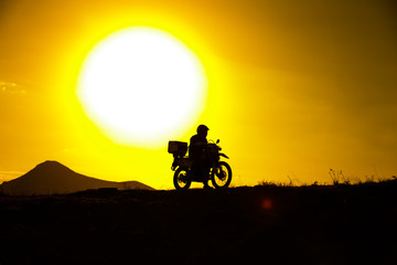 Fototapeta premium silhouette of the mountain motor drive
