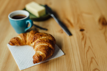 Breakfast with coffee and croissant