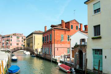 Fototapeta na wymiar Beautiful view of water street and old buildings in Venice, ITAL