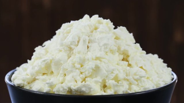 Cottage cheese. Rotates plate with cottage cheese . Close up