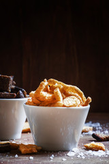 Rye crackers and baguette rusks with salt and spices in white bo