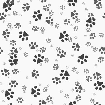 Animal paws. Random sized footprints. Seamless pattern. Vector illustration