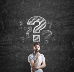 Man in T-shirt and question marks