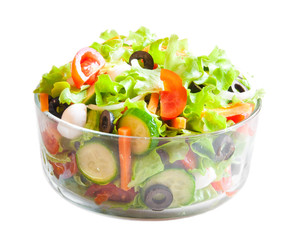 Vegetable salad in glass bowl, isolated on white