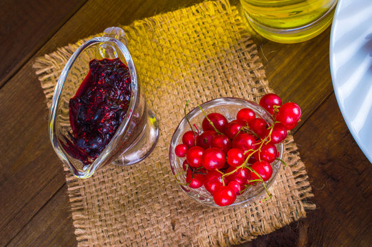 Healthy eating, diet concept - berries in glass cup on a wooden table.