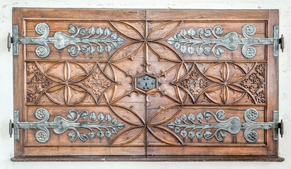 Beautiful antique carved double cabinet doors of wood with steel elements