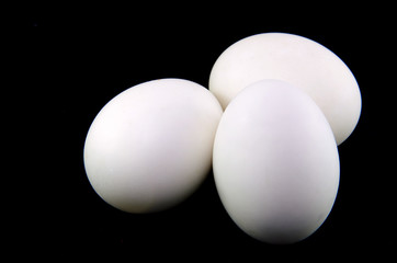 salted egg on black background