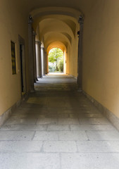 Arched hallway in an historic building in MIlan, with nobody around