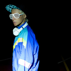 Girl DJ in the night city. Street fashion swag