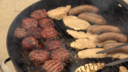 Flipping Hamburgers on a Charcoal Grill, 4K 100MBPS