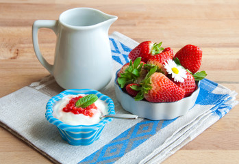 Yoghurt with strawberries in blue bowl