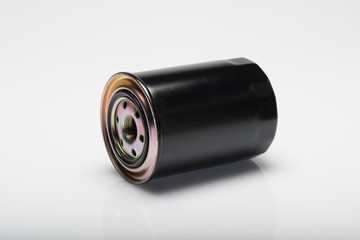 Black Oil Filter auto spare part, on the isolated white background
