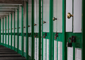 Beach hut chalet doors on the Gower peninsula at Langland Bay, Swansea, UK