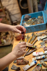 scattered on the table tools of the painter