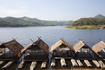 Fototapeta na wymiar Restaurant Bamboo raft floating on the water in the dam, Thailand