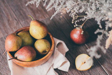 Fresh juicy organic pears on wooden table