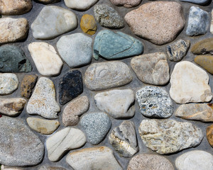 River rock stone wall with mortar joints