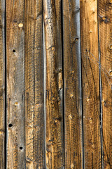 Vertical weathered knotty pine siding