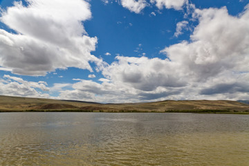 Landscape lake steppe clouds