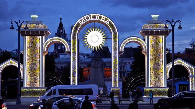 The painted gate in front of Bolshoi Theatre (the Grand Theatre) and the Karl Marx monument in the evening. UHD - 4K. September 09, 2016. Moscow. Russia